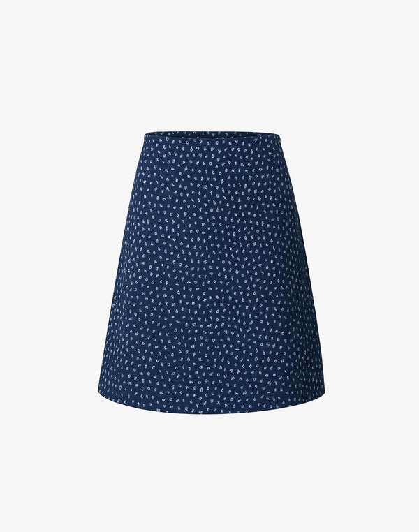 navy blue bias-cut mini skirt with white micro floral print