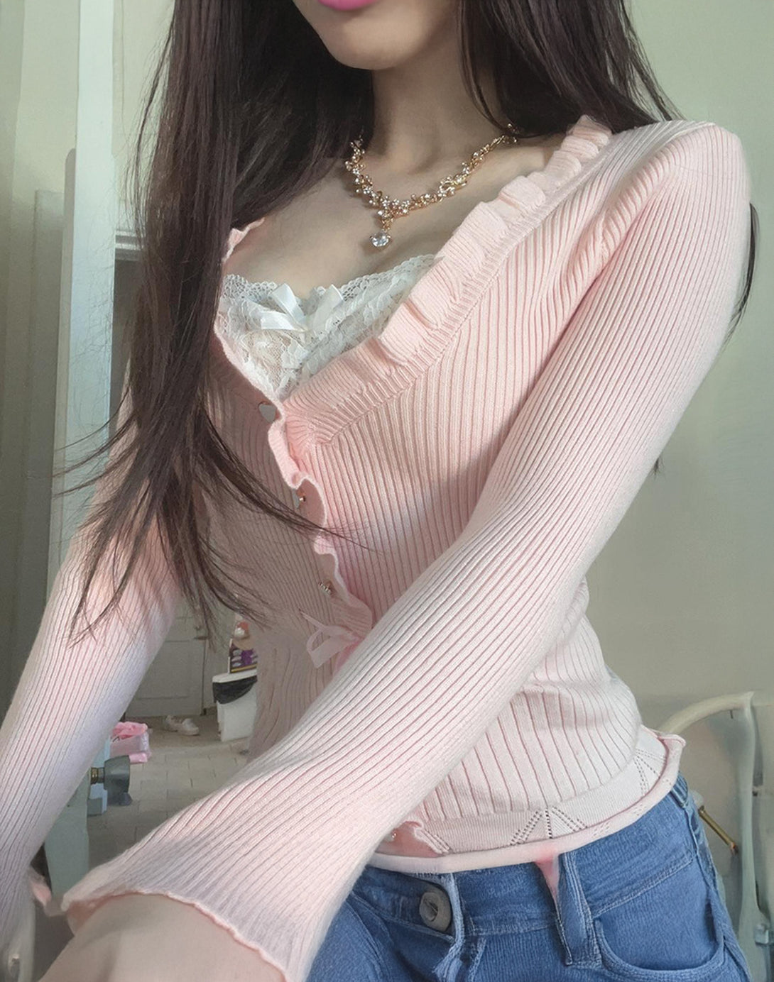Close-up of the V-neckline and lace detailing, showcasing the cute pink shirt style of this ladies pink top