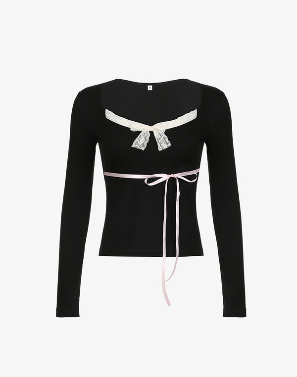 A black long sleeve dollette top featuring a cream lace bow and a pink ribbon waist tie.