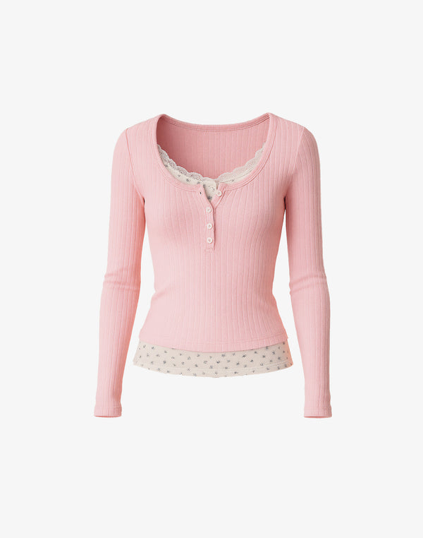 flat lay of pink ribbed layered henley top with floral cami insert and lace neckline