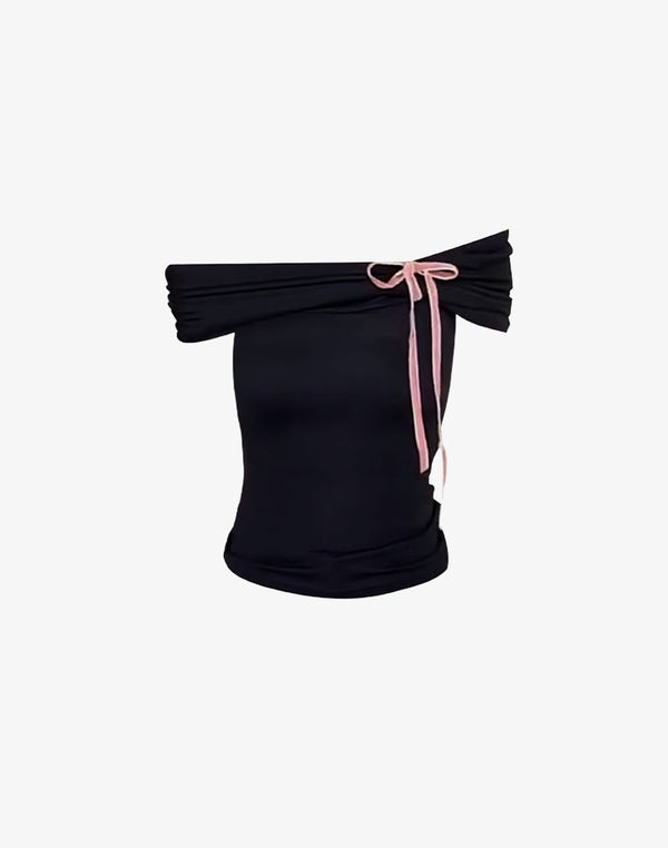 Black off-shoulder lace bow top with ruched fabric, perfect for coquette style and feminine fashion. Ideal for cute dates and casual hangouts.