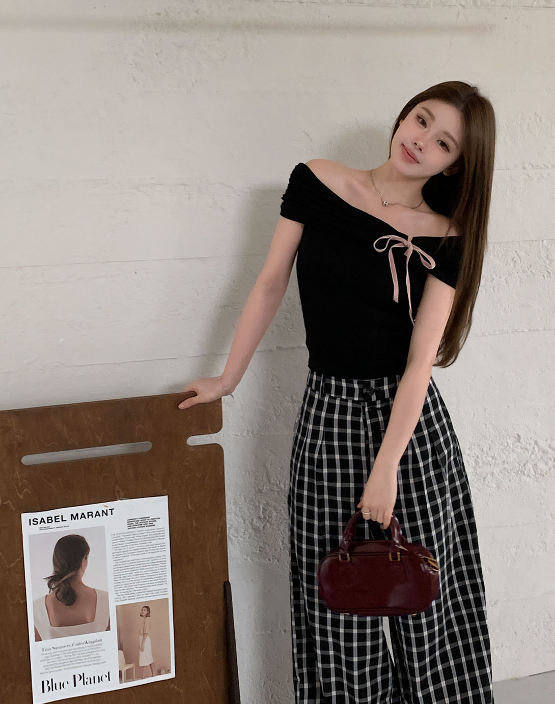 Full-body shot of model in off-shoulder lace bow top, styled in cute Korean fashion. A perfect piece for dollette style and casual chic outfits.