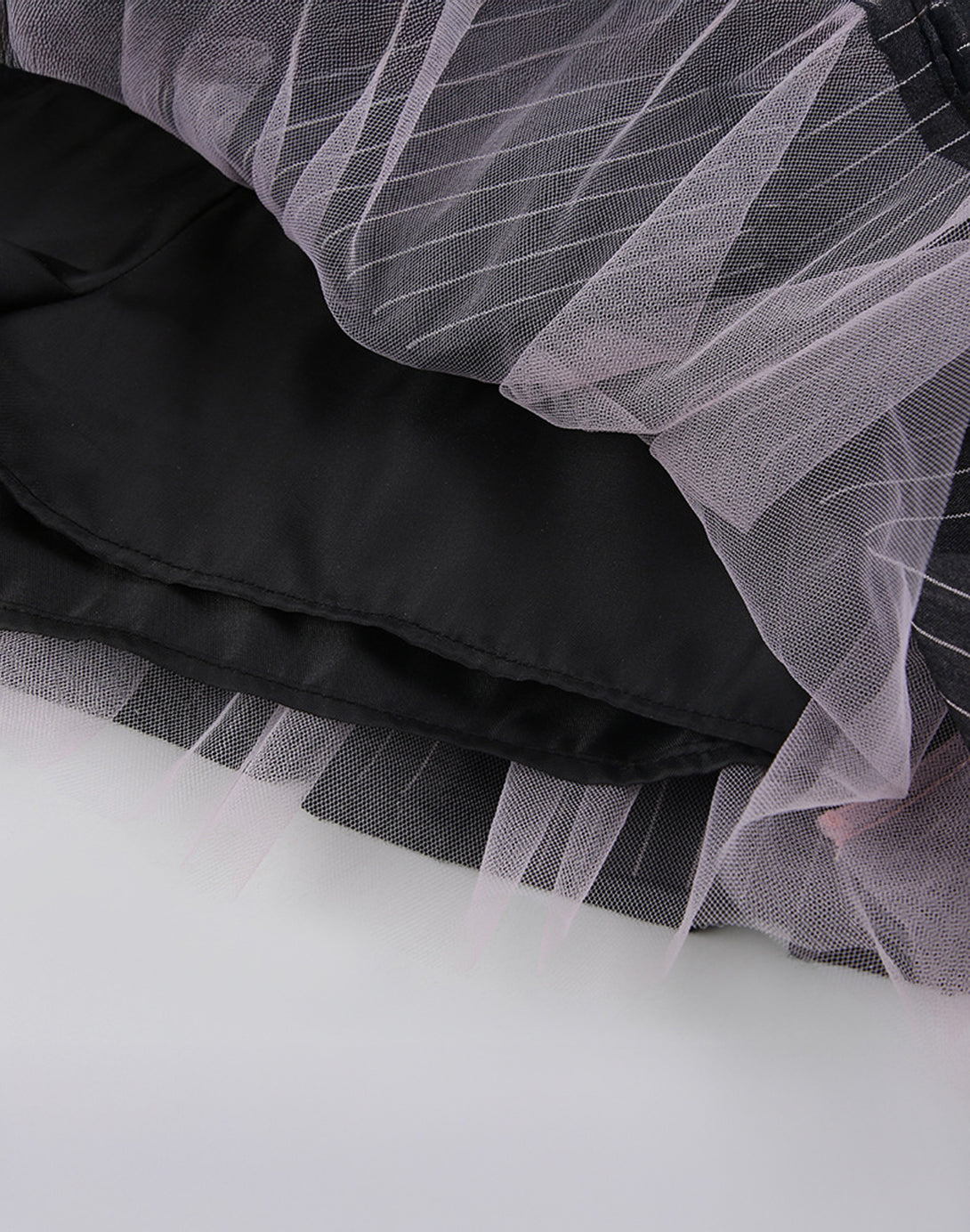 The skirt's interior lining, showing the built-in tulle petticoat that creates its classic Y2K volume.