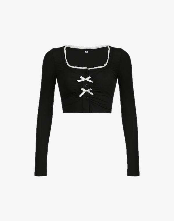 Black Ruched Bow Button Front Crop Top with a cute bow detail, perfect for hyper feminine and dollette style fashion.
