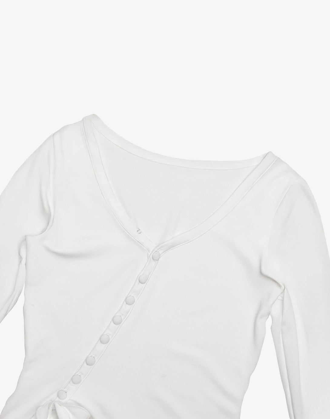 Detailed view of the V-neckline and button details on a white mini bodycon ruffle dress, highlighting the feminine fashion design.