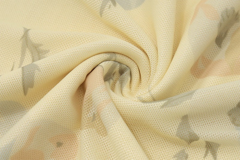 lightweight pastel yellow mesh fabric with soft stretch and watercolor floral print