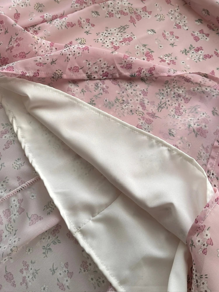 interior satin lining of pink chiffon dress with sheer floral overlay shown flipped open