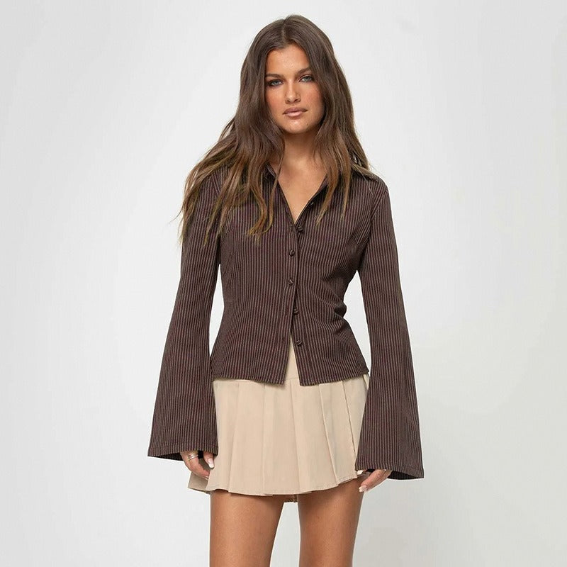 A model wears the retro pinstripe blouse with a mini skirt for a chic casual fashion look.