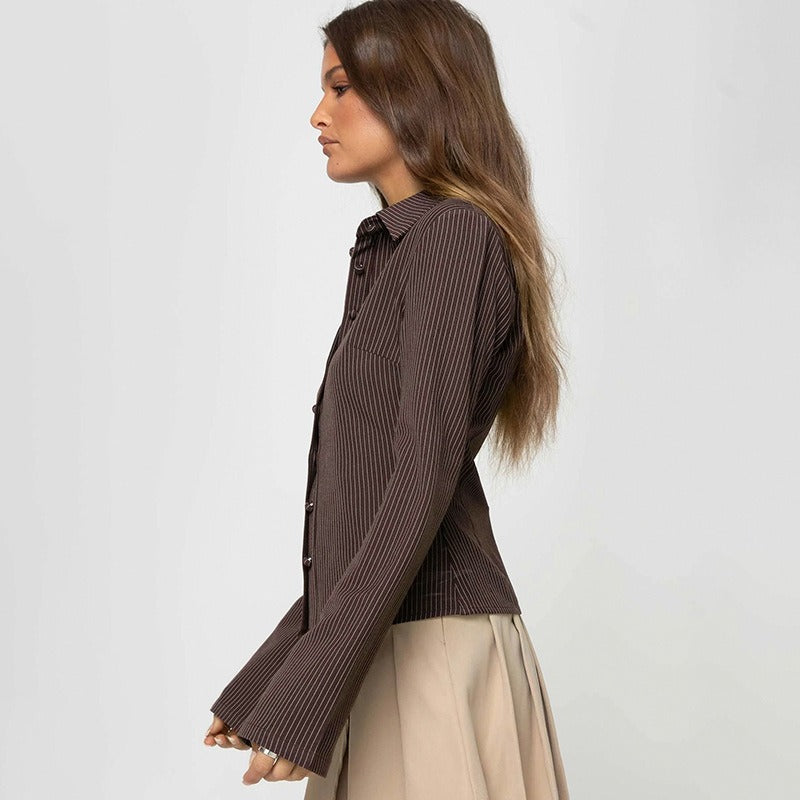 Side profile of a model wearing the brown collar shirt, showing the silhouette of the bell sleeve.