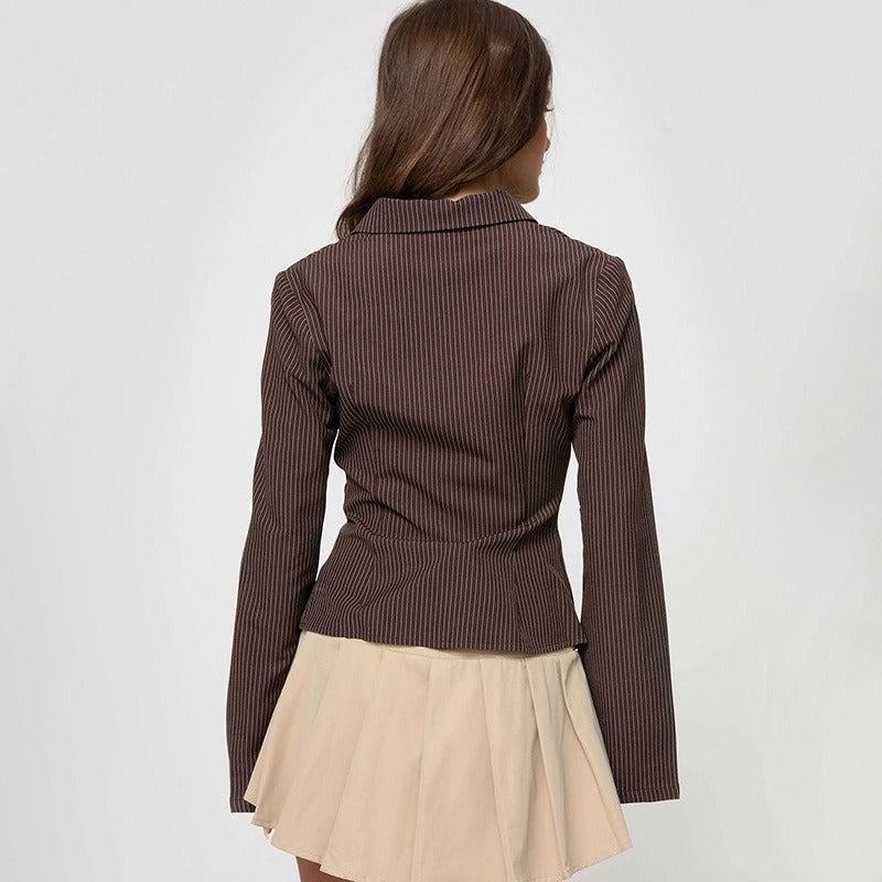 The back of the ladies fitted pinstripe blouse as seen on a model.
