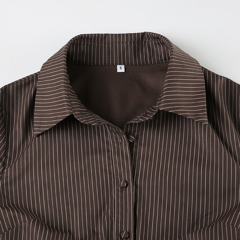 A detailed view of the large, pointed dagger collar on the retro long sleeve blouse.