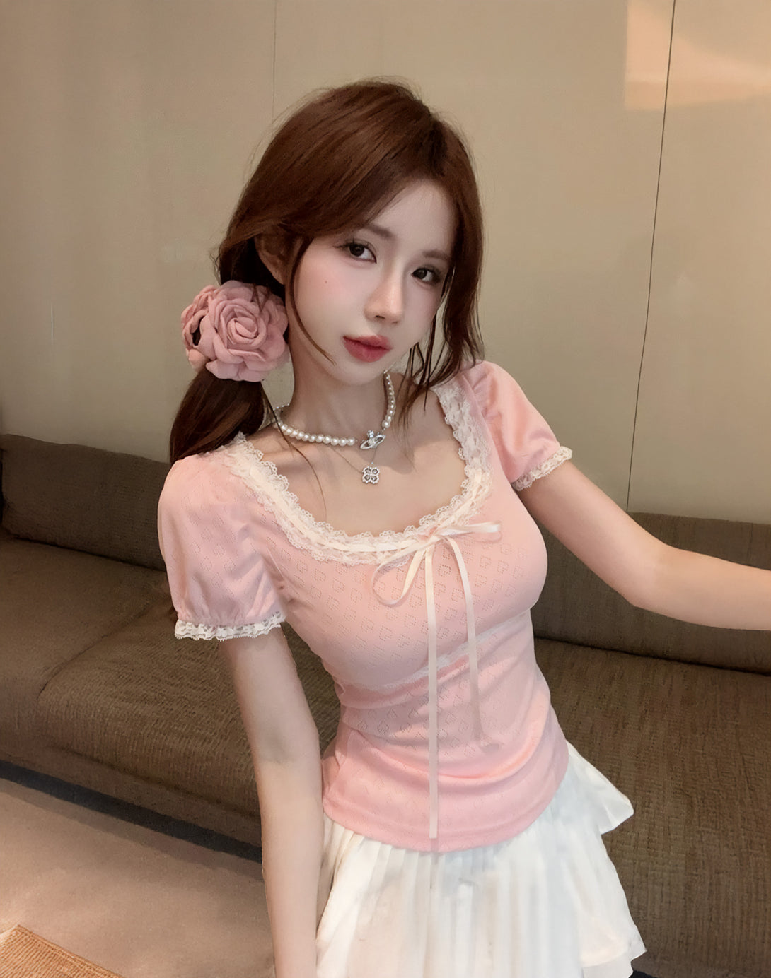 Model wearing the Sweetheart Kawaii Lace Trim Top with a white skirt, showing a kawaii and romantic vibe in a dollette fashion style.