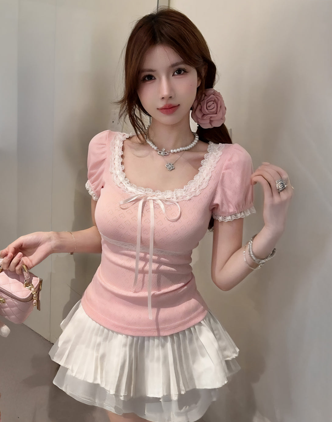 Model wearing the Sweetheart Kawaii Lace Trim Top with puffy sleeves and lace detailing, paired with a white skirt, showcasing kawaii fashion and hyper feminine style.