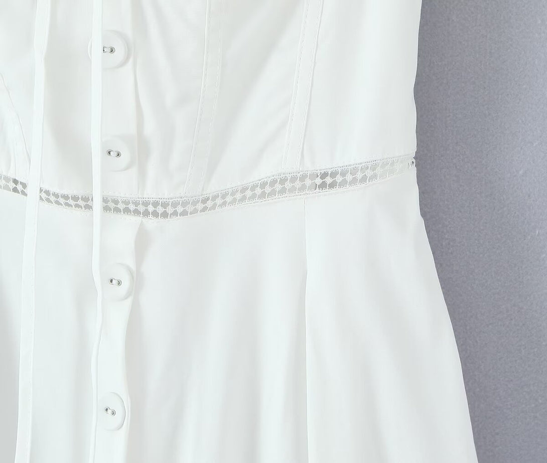 closeup of ruched bust and tie detail on feminine white prom dress