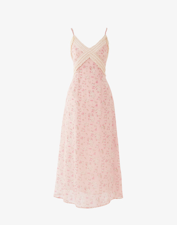 blush pink coquette midi dress with lace trim and ditsy floral print on white backdrop