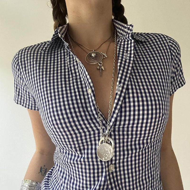 Closeup on a model to show the flattering silhouette of the ladies fitted gingham shirt.