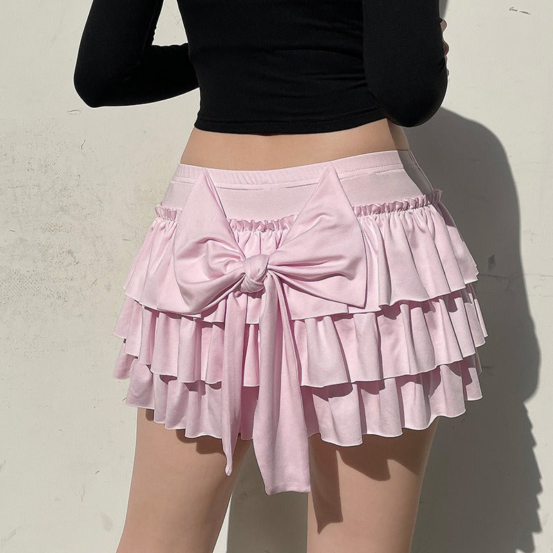 Angled view showcasing the hyper feminine fashion statement of the skirt with its large bow.