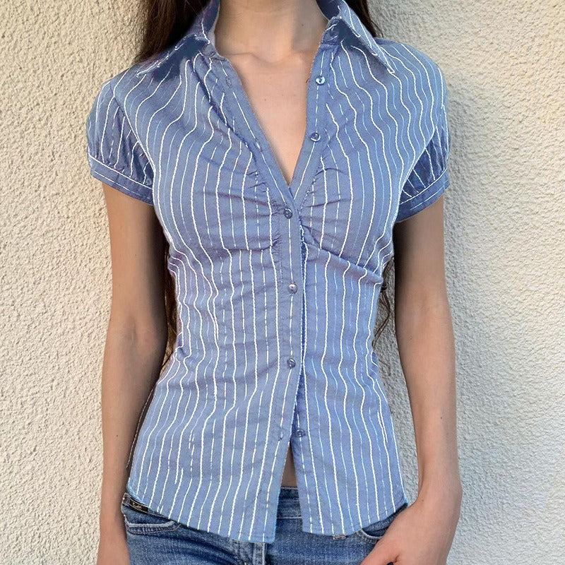 Angled view highlighting the flattering silhouette of the ladies fitted stretch blouse.