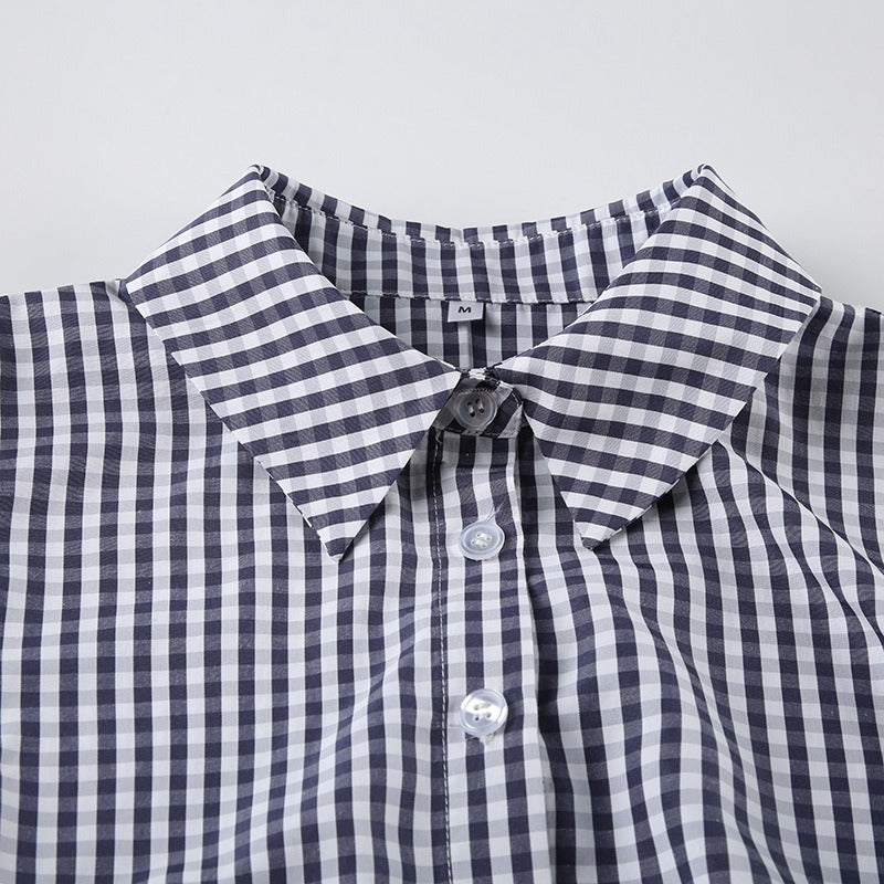The sharp pointed collar of the gingham shirt, suitable for both casual and smart formal fashion looks.