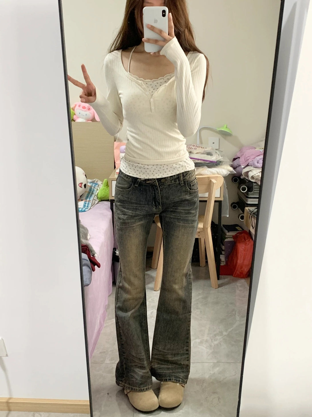 mirror selfie of cream coquette-style henley with ribbed fit and floral lace cami insert