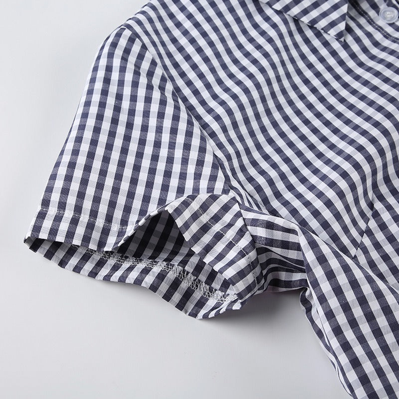 Closeup of the simple, cuffed short sleeve on the fitted shirt.