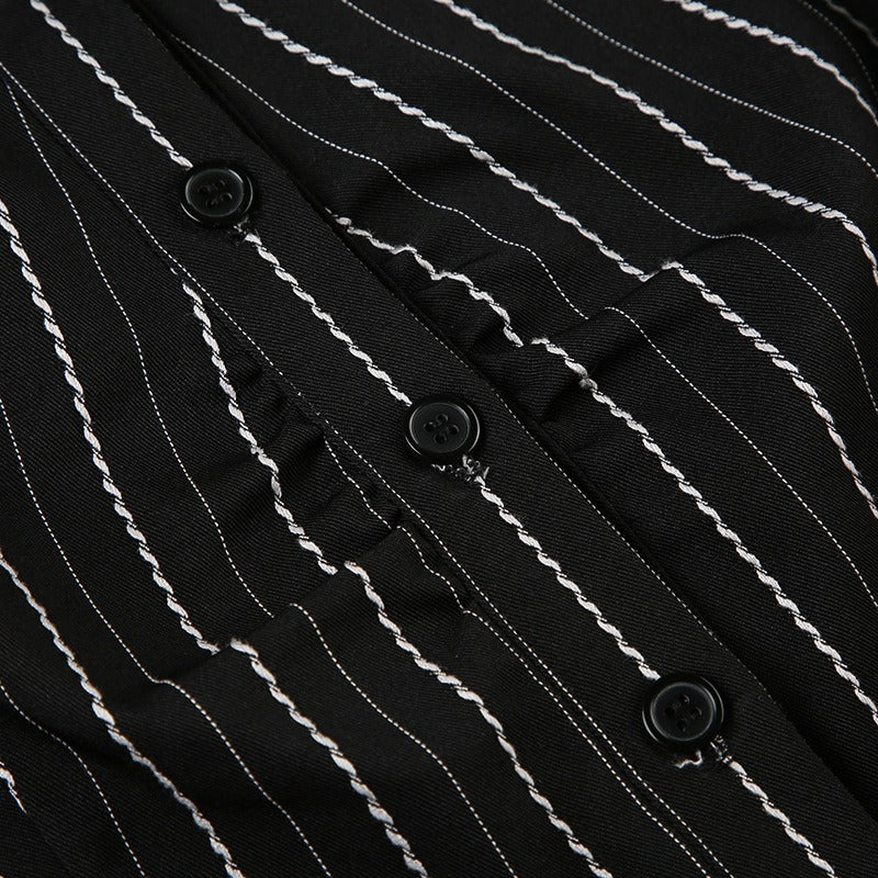 Closeup of the button-down placket, revealing the unique textured pinstripe and subtle ruffle details.