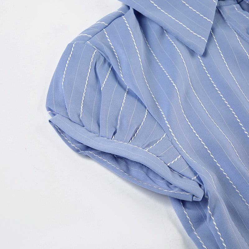 Closeup of the cuffed puff sleeve, a key feature of this feminine fashion blouse.